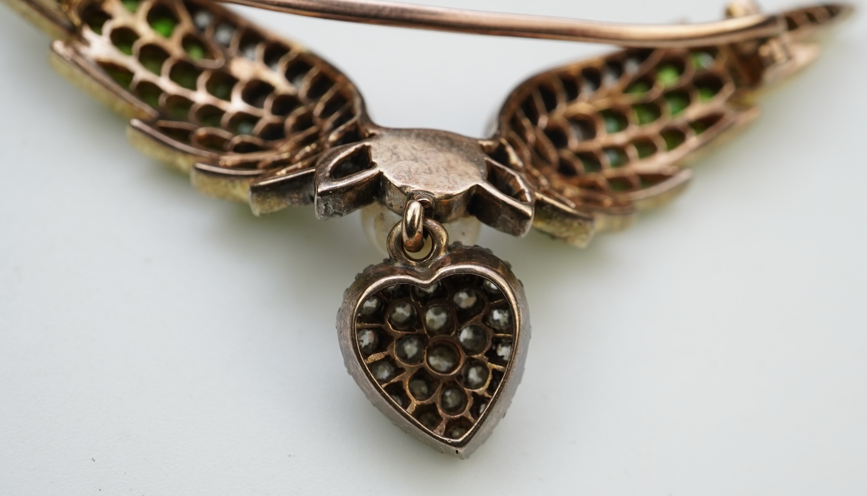 An attractive late Victorian demantoid garnet, pearl and diamond brooch, circa 1900